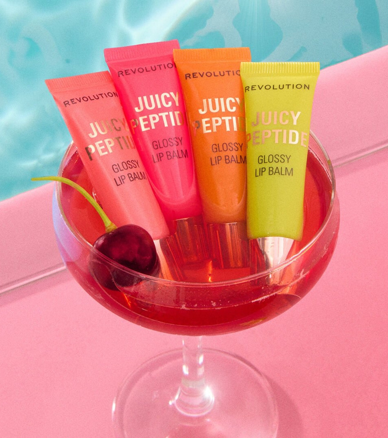 Makeup Revolution - Bálsamo labial con brillo Juicy Peptide - Guava Rum Punch Coral
