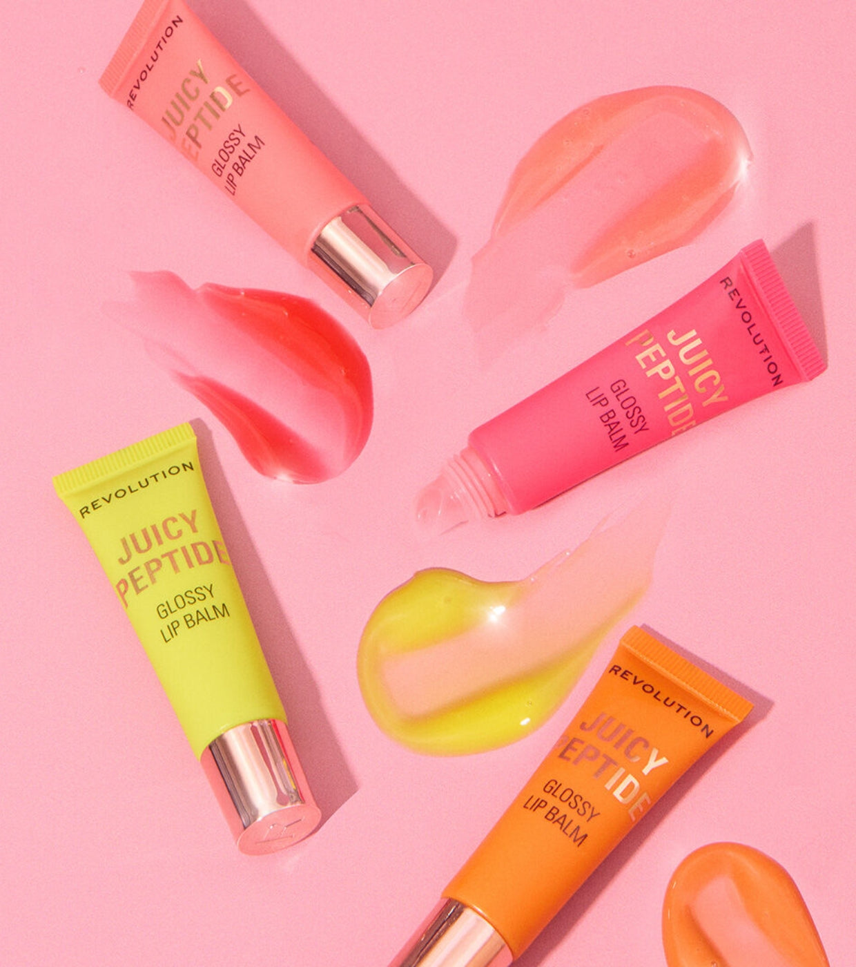 Makeup Revolution - Bálsamo labial con brillo Juicy Peptide - Guava Rum Punch Coral